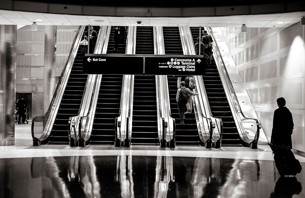 stairs-people-airport-escalators.jpg mmerlic 28-11